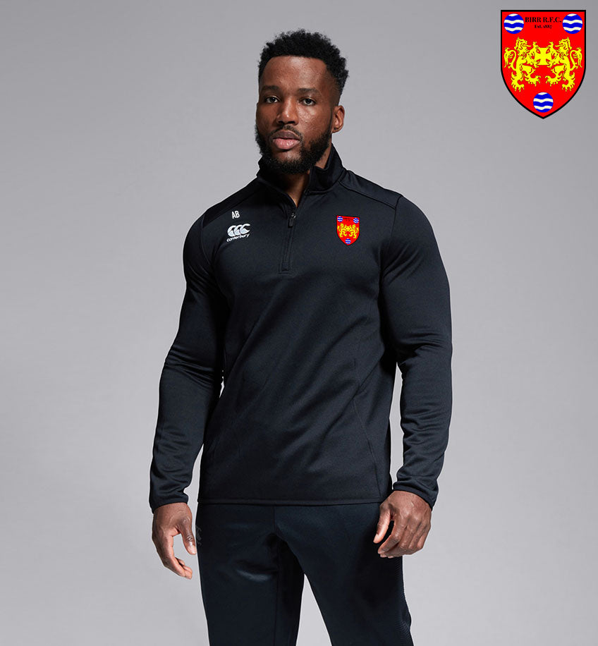A model showcasing the Birr RFC Canterbury Club 1/4 Zip Mid Layer Training Top in black, perfect for warm-ups and training sessions for players and fans, representing Birr RFC, Birr, Birr Rugby.