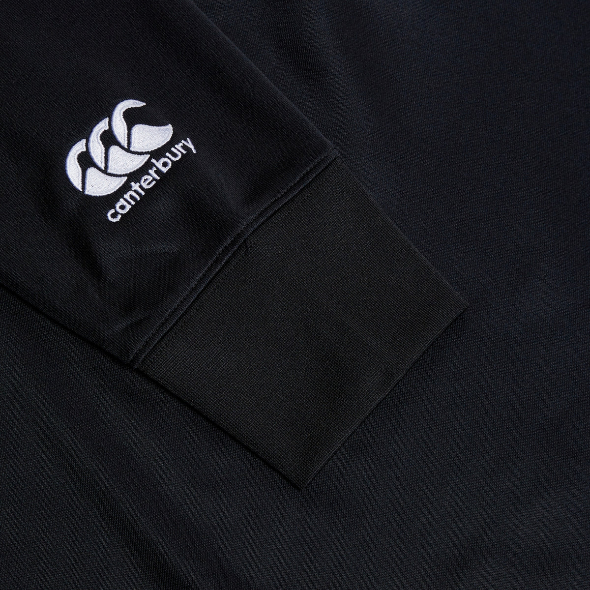 Detailed image of the Canterbury logo on the sleeve of the Birr RFC CCC Training Hood, showcasing the quality craftsmanship for fans of Birr Rugby.